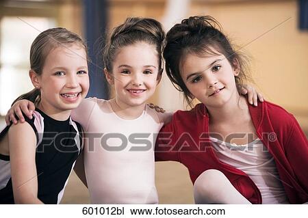 group of three young ballet dancers in close embrace View Large Photo Image Stock Image - group of three young ballet dancers in close embrace. Fotosearch
