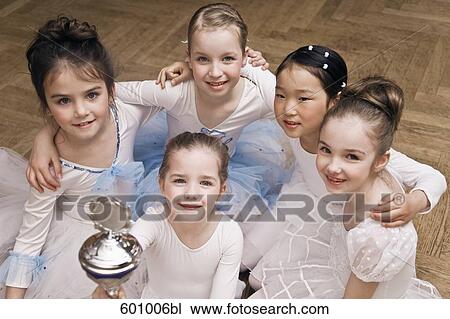 group of young ballet dancers one holding trophy View Large Photo Image Stock Image - group of young ballet dancers one holding trophy. Fotosearch