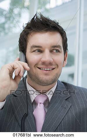 headshot of businessman talking on telephone View Large Photo Image Stock Image - headshot of businessman talking on telephone. Fotosearch