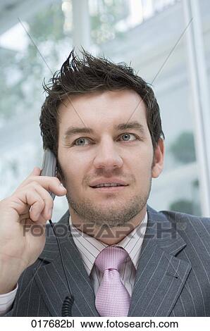 headshot of businessman talking on telephone View Large Photo Image Stock Image - headshot of businessman talking on telephone. Fotosearch