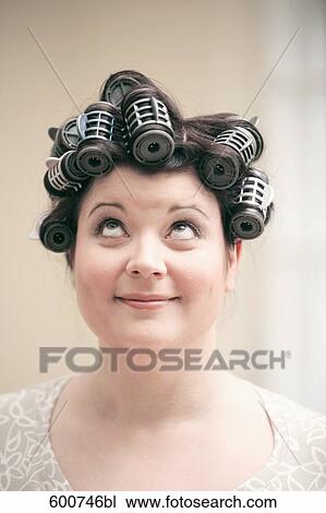 headshot of woman with curlers in her hair View Large Photo Image Stock Image - headshot of woman with curlers in her hair. Fotosearch