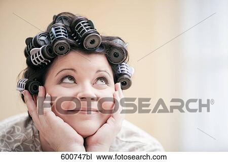 headshot of woman with curlers in her hair View Large Photo Image Stock Image - headshot of woman with curlers in her hair. Fotosearch