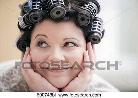 headshot of woman with curlers in her hair View Large Photo Image Stock Image - headshot of woman with curlers in her hair. Fotosearch