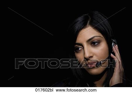 headshot of young woman wearing headset View Large Photo Image Stock Image - headshot of young woman wearing headset. Fotosearch
