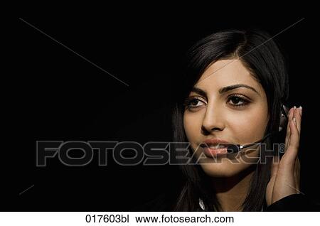 headshot of young woman wearing headset View Large Photo Image Stock Image - headshot of young woman wearing headset. Fotosearch