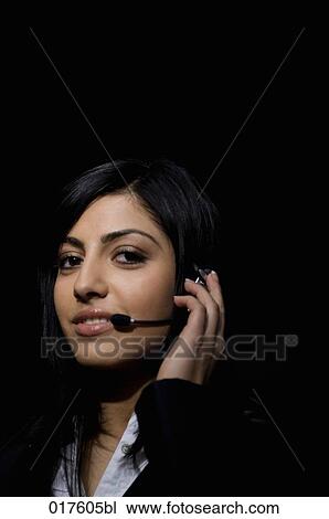 headshot of young woman wearing headset View Large Photo Image Stock Image - headshot of young woman wearing headset. Fotosearch