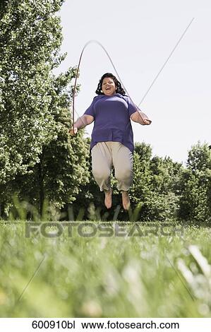 overweight woman skipping in park View Large Photo Image Stock Image - overweight woman skipping in park. Fotosearch