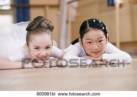 portait of tow young ballet dancers lying on floor View Large Photo Image Stock Image - portait of tow young ballet dancers lying on floor. Fotosearch
