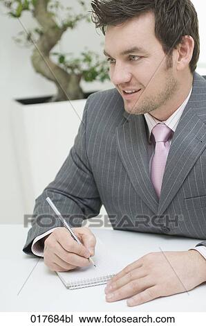 portrait of businessman making notes View Large Photo Image Stock Image - portrait of businessman making notes. Fotosearch