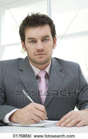 portrait of businessman making notes View Large Photo Image Stock Image - portrait of businessman making notes. Fotosearch