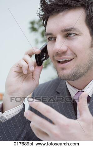 portrait of businessman talking on mobile phone View Large Photo Image Stock Image - portrait of businessman talking on mobile phone. Fotosearch