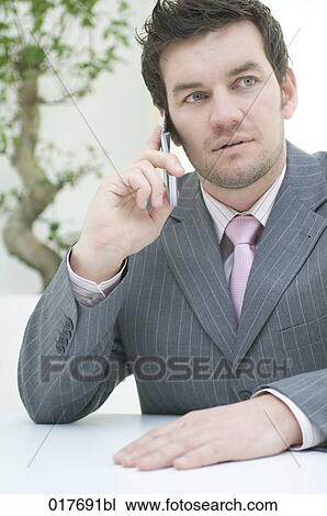 portrait of businessman talking on mobile phone View Large Photo Image Stock Image - portrait of businessman talking on mobile phone. Fotosearch