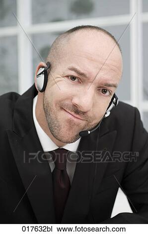 portrait of businessman wearing headset View Large Photo Image Stock Image - portrait of businessman wearing headset. Fotosearch
