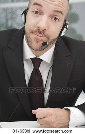 portrait of businessman wearing headset View Large Photo Image Stock Image - portrait of businessman wearing headset. Fotosearch