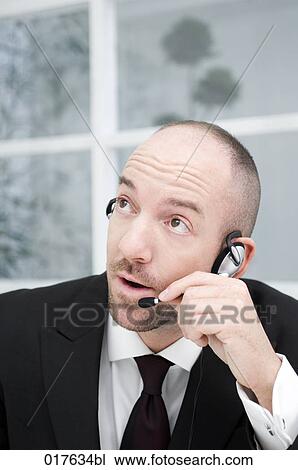 portrait of businessman wearing headset View Large Photo Image Stock Image - portrait of businessman wearing headset. Fotosearch