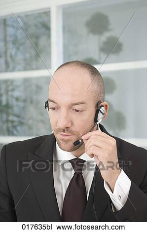 portrait of businessman wearing headset View Large Photo Image Stock Image - portrait of businessman wearing headset. Fotosearch