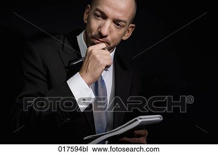 portrait of businessman with pen and writing pad View Large Photo Image Stock Image - portrait of businessman with pen and writing pad. Fotosearch