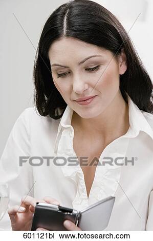 portrait of businesswoman in restaurant writing in her diary View Large Photo Image Stock Image - portrait of businesswoman in restaurant writing in her diary. Fotosearch