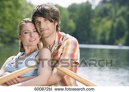 portrait of couple embracing in rowing boat View Large Photo Image Stock Image - portrait of couple embracing in rowing boat. Fotosearch