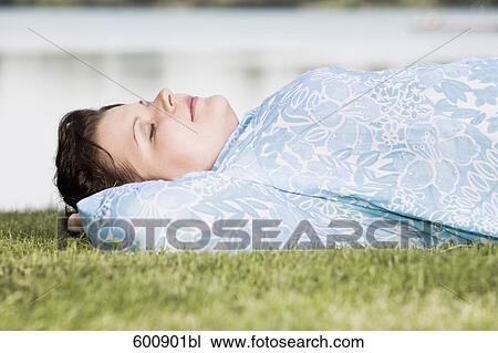 portrait of overweight woman dozing in grass View Large Photo Image Stock Image - portrait of overweight woman dozing in grass. Fotosearch