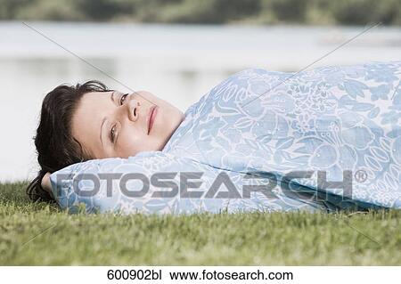 portrait of overweight woman lying in grass View Large Photo Image Stock Image - portrait of overweight woman lying in grass. Fotosearch