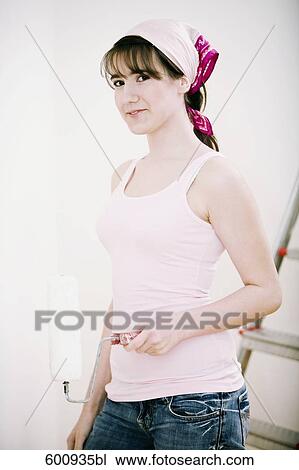 portrait of teenage girl holding paint roller View Large Photo Image Stock Image - portrait of teenage girl holding paint roller. Fotosearch