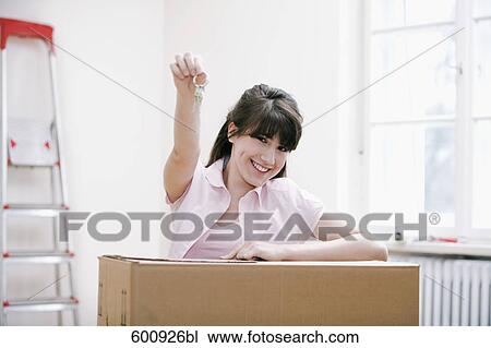portrait of teenage girl in new home holding keys View Large Photo Image Stock Image - portrait of teenage girl in new home holding keys. Fotosearch