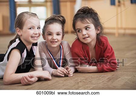 portrait of three young ballet dancers lying on floor View Large Photo Image Stock Image - portrait of three young ballet dancers lying on floor. Fotosearch