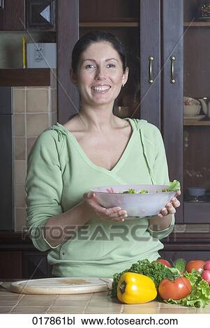 portrait of woman in kitchen holding salad bowl View Large Photo Image Stock Image - portrait of woman in kitchen holding salad bowl. Fotosearch