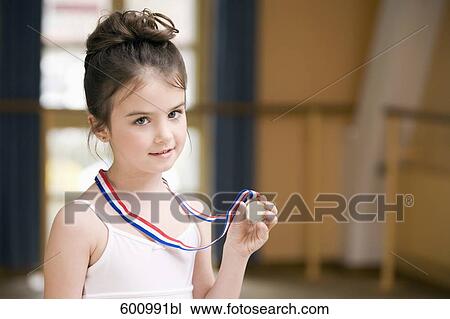 portrait of young ballet dancer holding medal View Large Photo Image Stock Image - portrait of young ballet dancer holding medal. Fotosearch