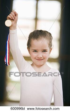 portrait of young ballet dancer holding medal View Large Photo Image Stock Image - portrait of young ballet dancer holding medal. Fotosearch