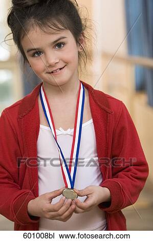 portrait of young ballet dancer holding medal View Large Photo Image Stock Image - portrait of young ballet dancer holding medal. Fotosearch
