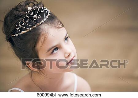 Stock Image - portrait of young ballet dancer wearing little crown. Fotosearch