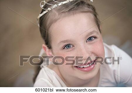 Stock Image - portrait of young ballet dancer wearing little crown. Fotosearch