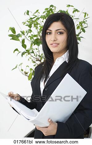 portrait of young businesswoman holding folder View Large Photo Image Stock Image - portrait of young businesswoman holding folder. Fotosearch