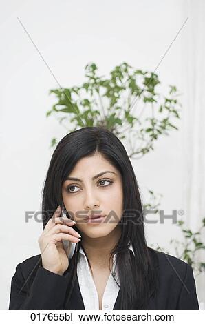 portrait of young businesswoman talking on mobile phone View Large Photo Image Stock Image - portrait of young businesswoman talking on mobile phone. Fotosearch