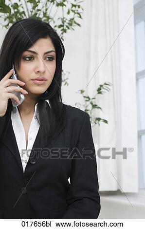 portrait of young businesswoman talking on mobile phone View Large Photo Image Stock Image - portrait of young businesswoman talking on mobile phone. Fotosearch