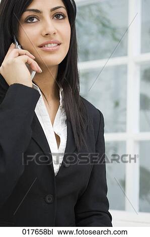 portrait of young businesswoman talking on mobile phone View Large Photo Image Stock Image - portrait of young businesswoman talking on mobile phone. Fotosearch