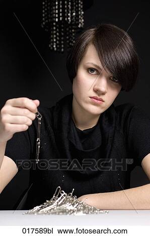 portrait of young businesswoman with paper clip chain View Large Photo Image Stock Image - portrait of young businesswoman with paper clip chain. Fotosearch