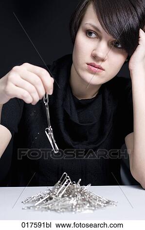 portrait of young businesswoman with paper clip chain View Large Photo Image Stock Image - portrait of young businesswoman with paper clip chain. Fotosearch