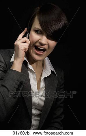 portrait of young businesswoman with mobile phone View Large Photo Image Stock Image - portrait of young businesswoman with mobile phone. Fotosearch