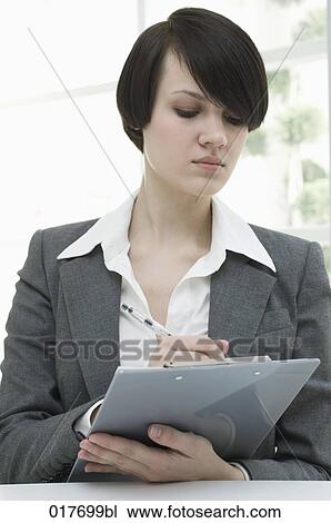 portrait of young businesswoman with pen and clipboard View Large Photo Image Stock Image - portrait of young businesswoman with pen and clipboard. Fotosearch