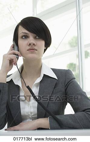 portrait of young busineswoman talking on telephone View Large Photo Image Stock Image - portrait of young busineswoman talking on telephone. Fotosearch