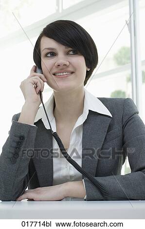 portrait of young busineswoman talking on telephone View Large Photo Image Stock Image - portrait of young busineswoman talking on telephone. Fotosearch