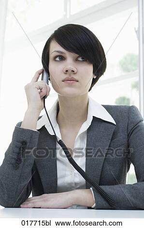 portrait of young busineswoman talking on telephone View Large Photo Image Stock Image - portrait of young busineswoman talking on telephone. Fotosearch