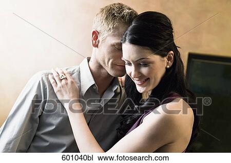 portrait of young couple embracing in bar View Large Photo Image Stock Image - portrait of young couple embracing in bar. Fotosearch
