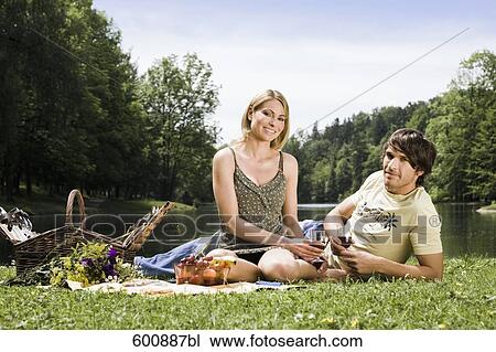 portrait of young couple having picnic in park View Large Photo Image Stock Image - portrait of young couple having picnic in park. Fotosearch