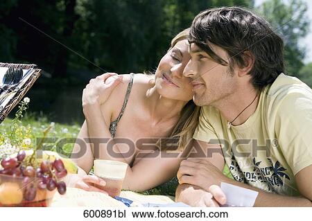 portrait of young couple having picnic View Large Photo Image Stock Image - portrait of young couple having picnic. Fotosearch