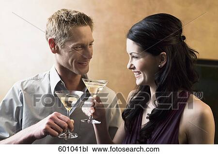 portrait of young couple in bar with cocktail glasses View Large Photo Image Stock Image - portrait of young couple in bar with cocktail glasses. Fotosearch