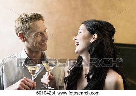 portrait of young couple in bar with cocktail glasses View Large Photo Image Stock Image - portrait of young couple in bar with cocktail glasses. Fotosearch